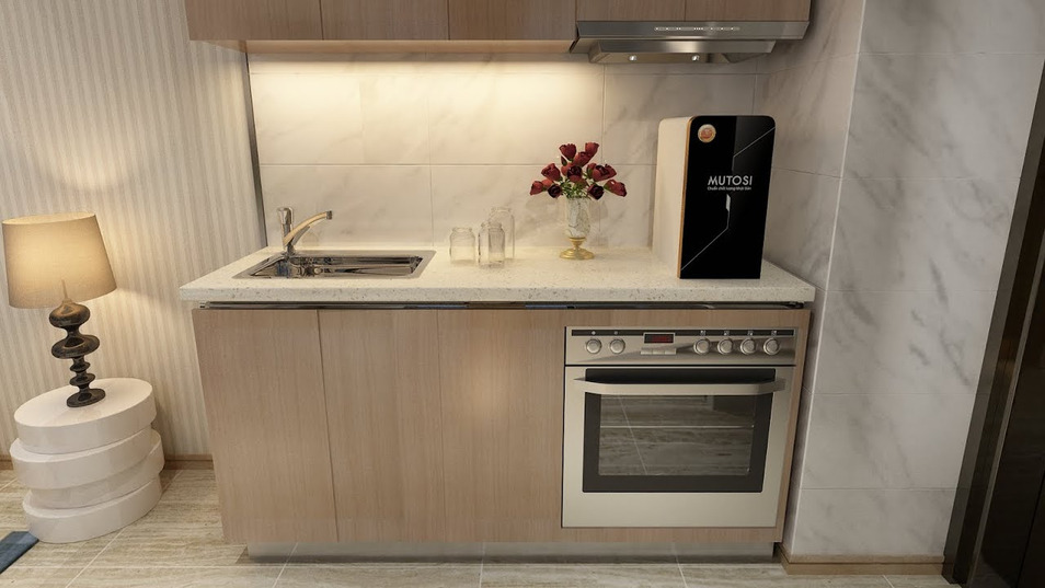 Tận dụng mặt bàn bếp rộng rãi để bố trí máy lọc nước một cách gọn gàng, tiện lợi cho việc lấy nước nấu nướng và sinh hoạt hằng ngày